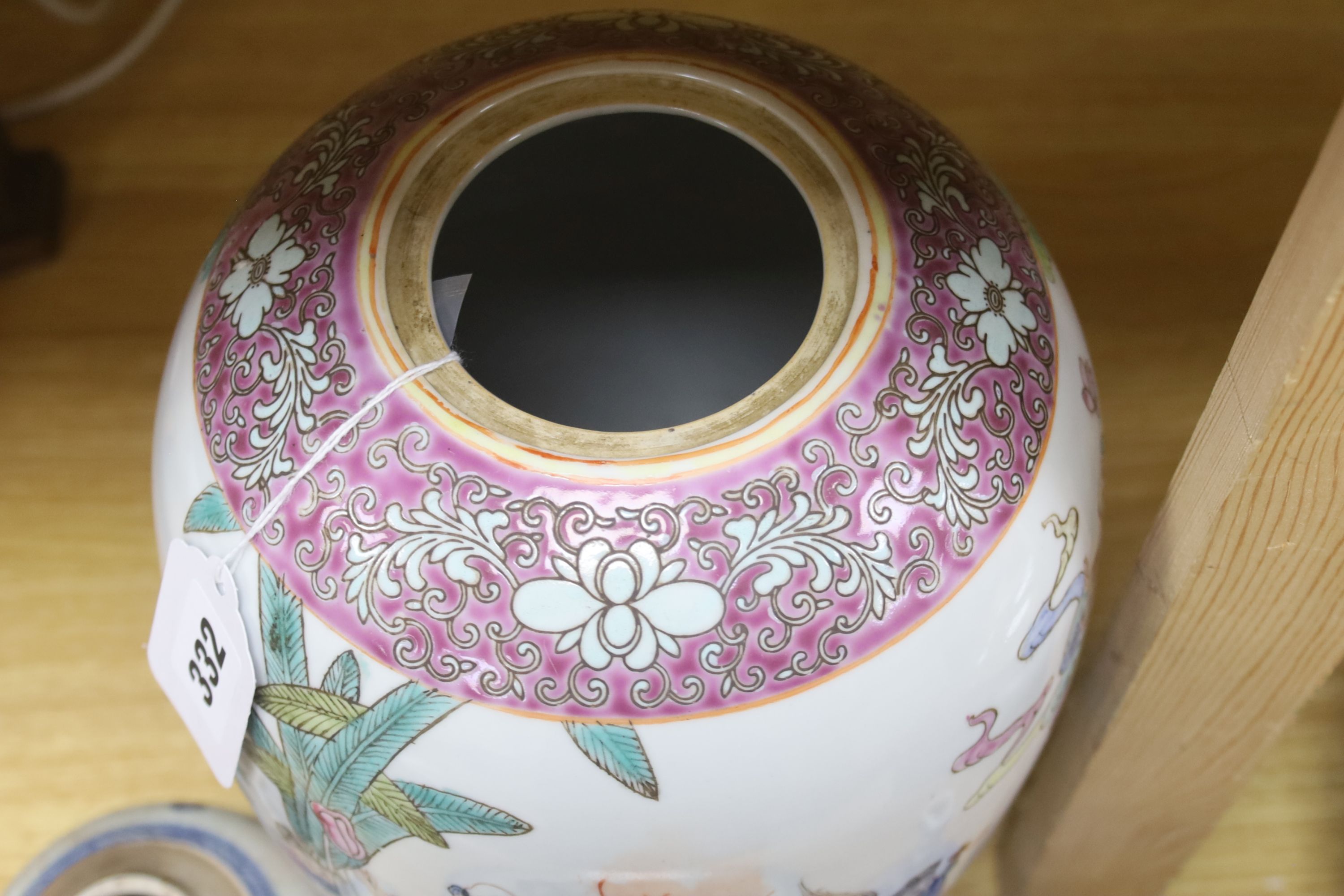 A Chinese blue and white dish, a bottle vase and jar, together with a famille rose jar lacking cover, height 29cm